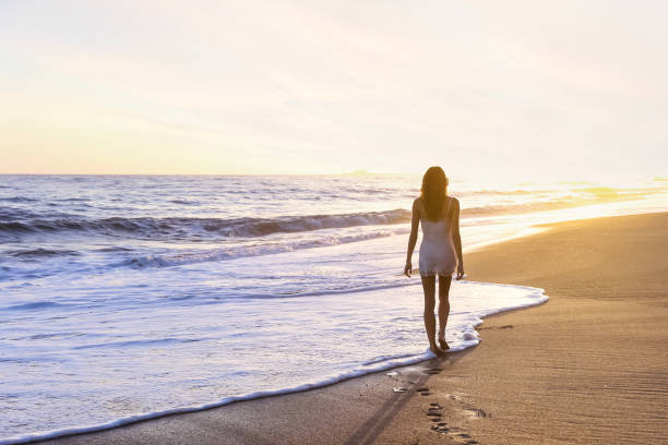 istock Young woman on the beach 1406399085