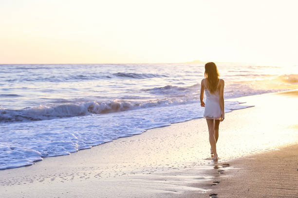 istock Young woman on the beach 1406399086