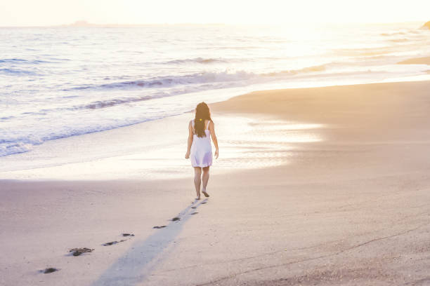 istock Young woman on the beach 1406399123