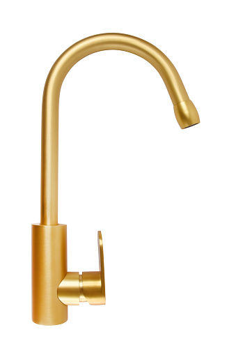 Gold colored, golden faucet isolated on the white background with clipping path