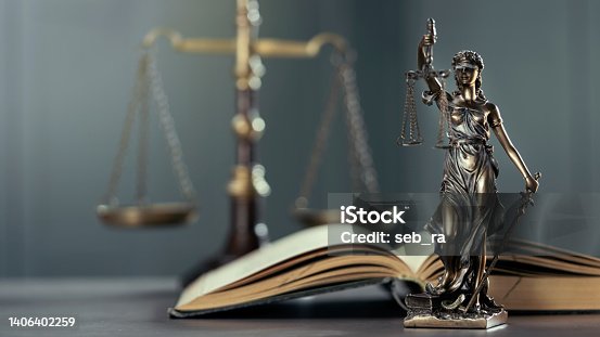 istock Legal and law concept statue of Lady Justice on the table with book and scale 1406402259