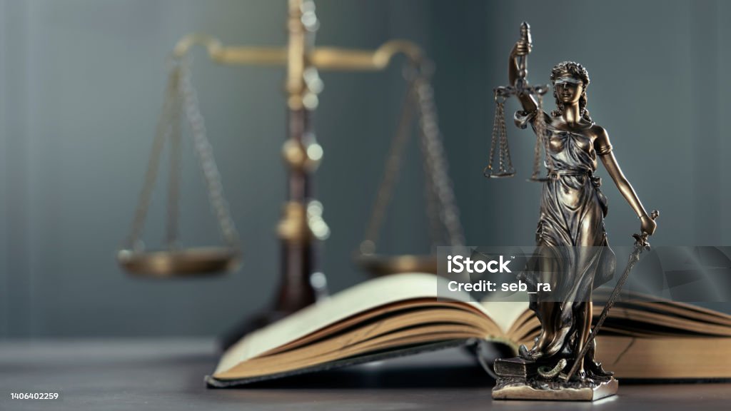 Legal and law concept statue of Lady Justice on the table with book and scale Lady Justice Stock Photo