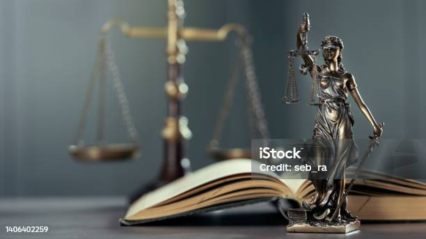 Legal And Law Concept Statue Of Lady Justice On The Table With Book And Scale Stock Photo - Download Image Now