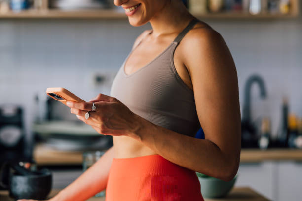 istock Anonymous Woman Texting On Her Smartphone 1406403633