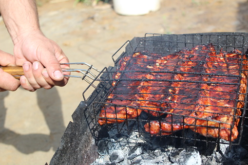photo barbecue on the grill. grilled ribs with meat. delicious pork meat.