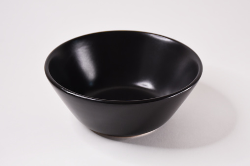 White Ceramic Bowl on Black Background