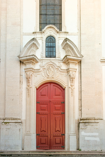 A front porch with a red door