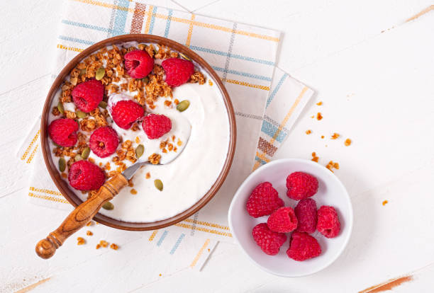 istock Vanilla yogurt with granola and raspberries 1406411732
