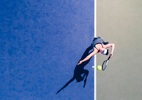 Young woman playing tennis.