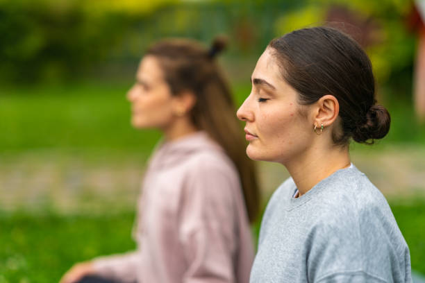 istock Girlfriends relaxing exercises outdoor 1406424051