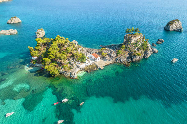 the island of panagia with church located right in front of the port of parga among in blue, turquoise sea water. aerial, top, drone view. greece - parga bildbanksfoton och bilder