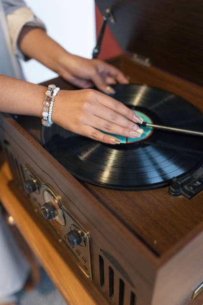 istock music on a record player with vintage wooden design, player with acetate disc, old objects 1406437710