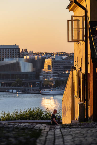 Stockholm, Sweden June 25, 2022 People on the Monteliusvagen walkway overlooking the city.