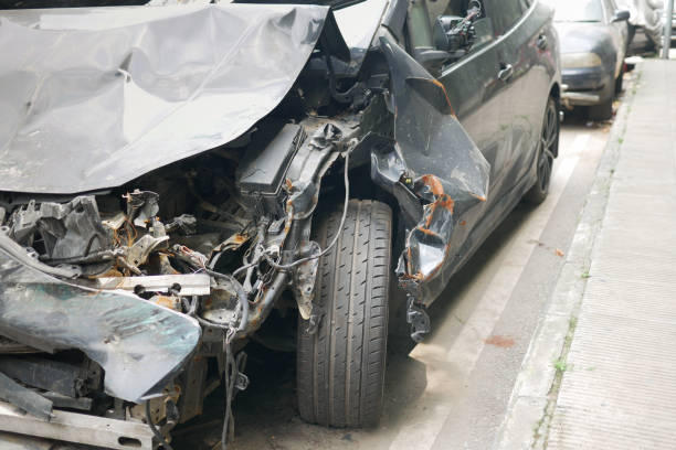 istock black car damaged by a road accident 1406439577