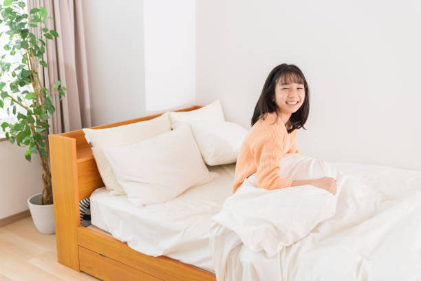 istock girl in bed , smile 1406443874