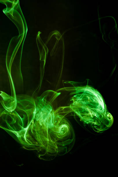 istock Green smoke motion on black background. 1406444671