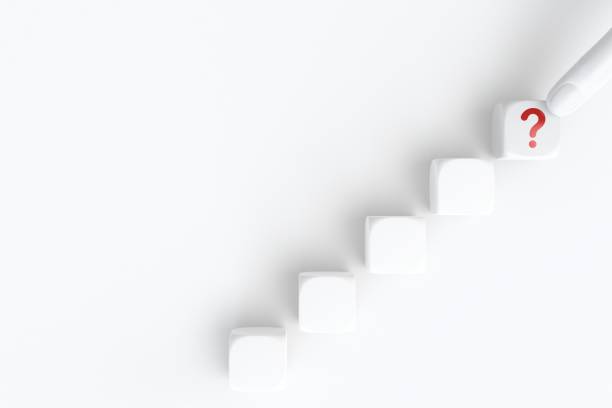 istock Questions Mark word in cube block on white background. FAQ Answer, Q&A. Copy space. 1406446170