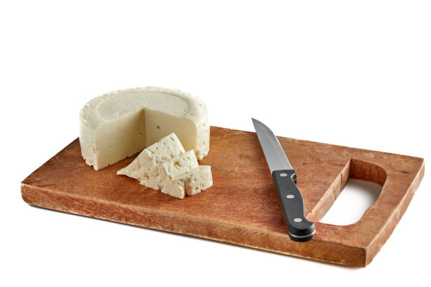 istock Fresh panela cheese made in Mexico on old rustic wooden board. 1406450331