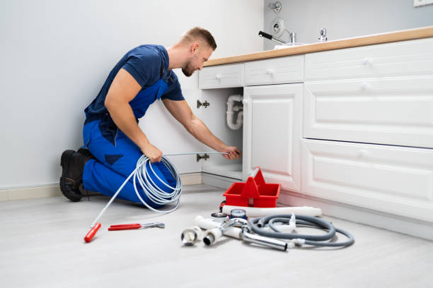 istock Plumber Cleaning Clogged Sink Pipe 1406459125