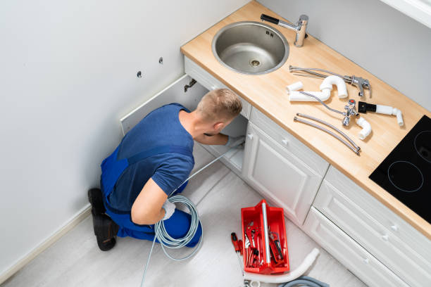 istock Plumber Cleaning Clogged Sink Pipe 1406459133