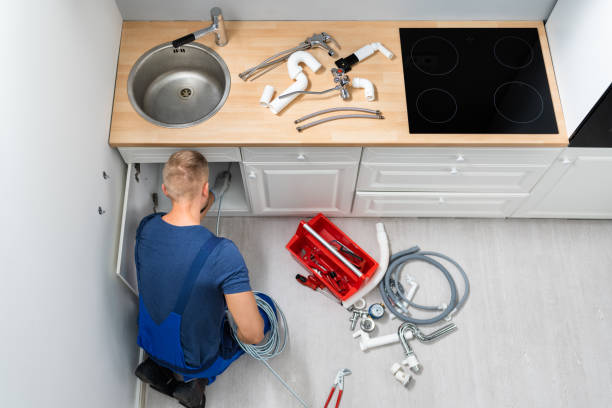 istock Plumber Cleaning Clogged Sink Pipe 1406459138