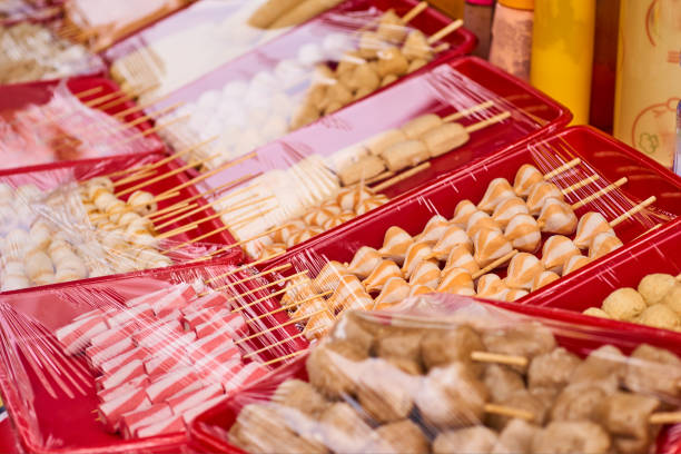 istock Fresh sausage and hot dogs with different  shape on a red box and covered with plastic wrap 1406459143