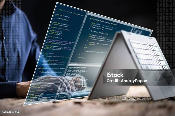 Computer Programmer Writing Program Code On Computer Stock Photo - Download Image Now