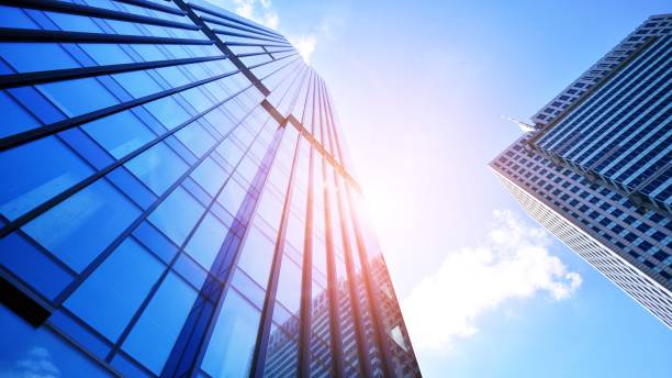 istock Modern office building with glass facade on a clear sky background. 1406459795