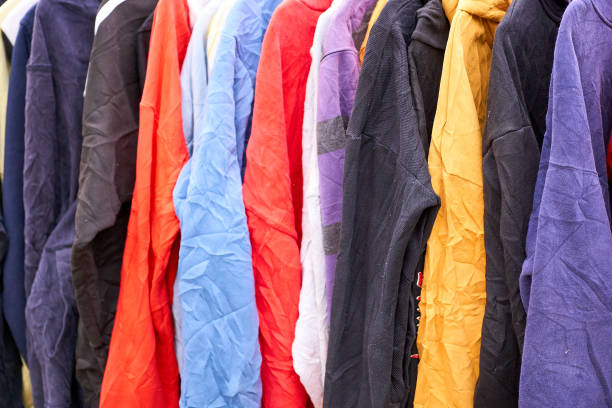 istock Colorful clothes hanging for sale 1406461383