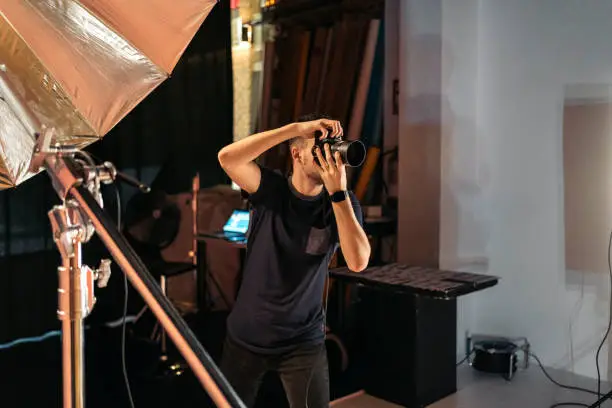 Photo of Photographer Working in Studio