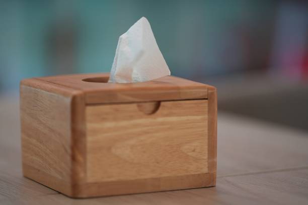 istock Wooden tissue box on blur background and copy space for put some text, close up. 1406465710