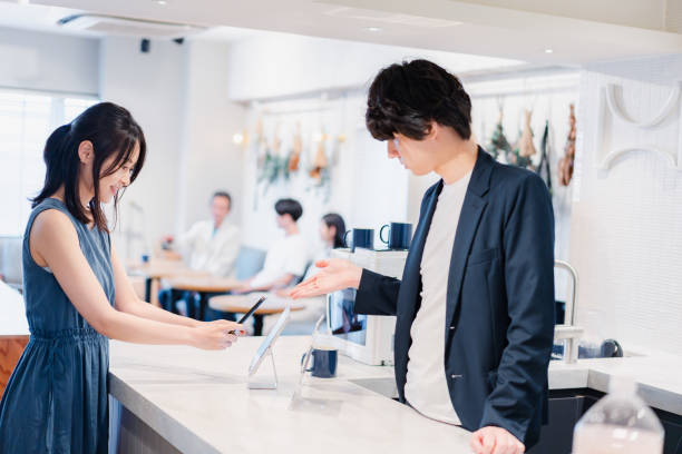 istock Young woman making a payment on her smartphone 1406466572