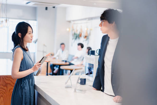 istock Young woman making a payment on her smartphone 1406466584