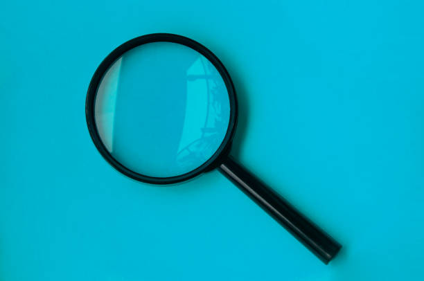 istock Blank magnifying glass on blue cover background. 1406471947