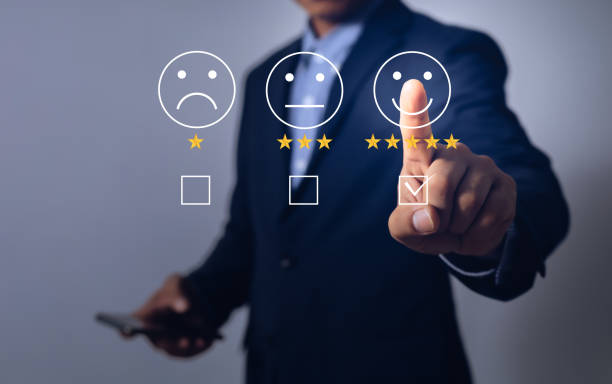 istock business men pointing fingers to rate satisfaction 1406472014