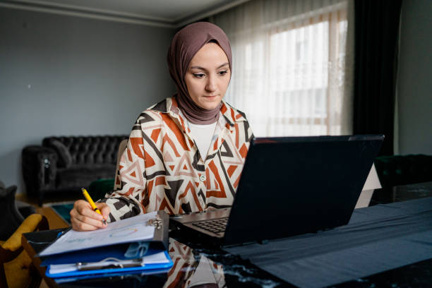 istock Muslim woman working 1406474374