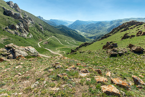 Pass and road below in summer in Kyrgyzstan