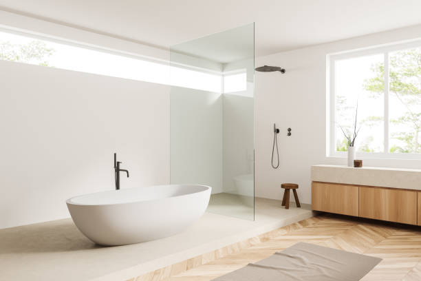 istock Light bathroom interior tub with douche and accessories, panoramic window 1406475386