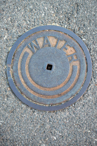 istock metal water street cover with textured pattern around it 1406475408