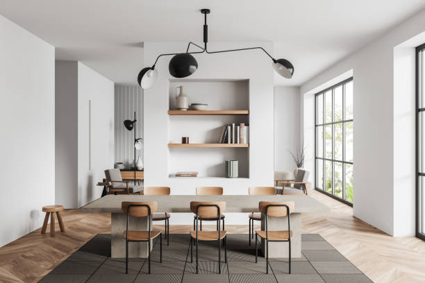 istock Stylish apartment interior with dining area and lounge zone, panoramic window 1406475508