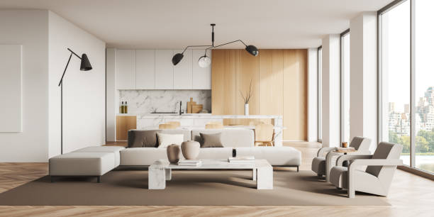 istock Stylish kitchen interior with couch and table with chairs, cooking area, window 1406476573