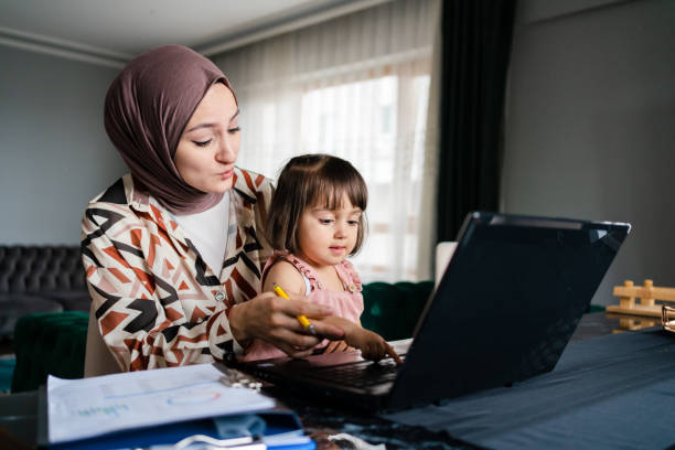 istock Middle Eastern Mother working from home with kid 1406479319