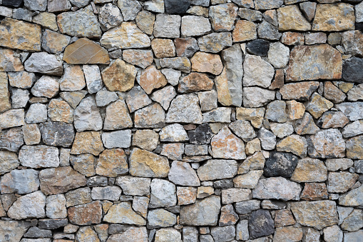 very old stone wall with various material, background, texture