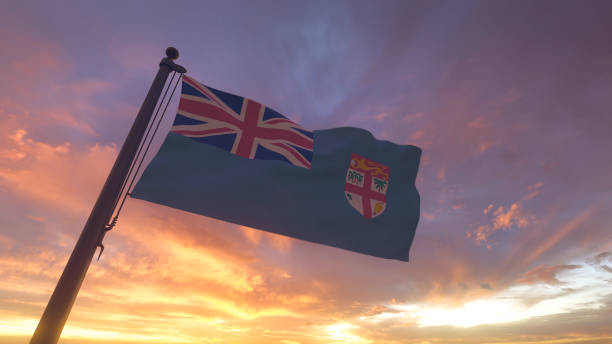 istock Fiji Flag on Flagpole by Evening Sunset Sky 1406483087