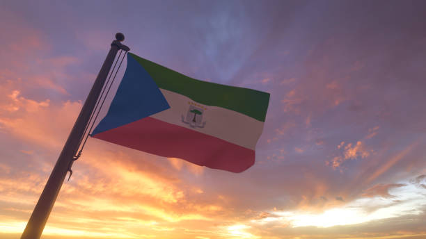 Equatorial Guinea Flag on Flagpole by Evening Sunset Sky stock photo