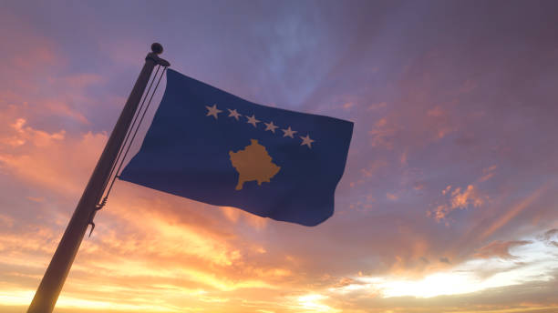 istock Kosovo Flag on Flagpole by Evening Sunset Sky 1406483129