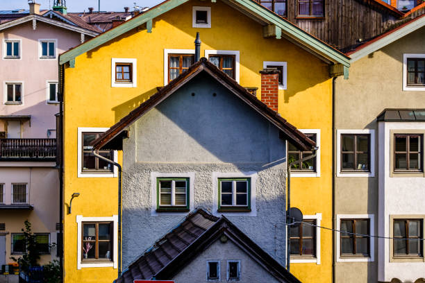Typical windows of a house in a small town in Austria. Home in the Austrian city of Gmunden in a rainy day. Retro style