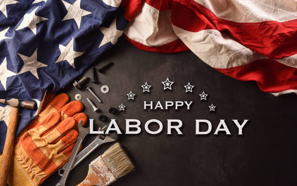 Happy Labor day concept. American flag with different construction tools and the text on dark stone background. Happy Labor day concept. American flag with different construction tools and the text on dark stone background. september photos stock pictures, royalty-free photos & images