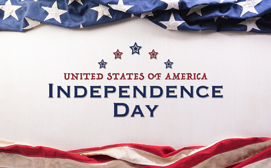 Happy Independence day concept made from American flag with the text on white wooden background.
