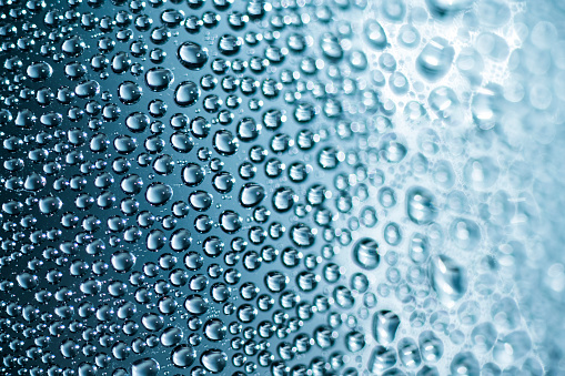 Blue drops of water on surface